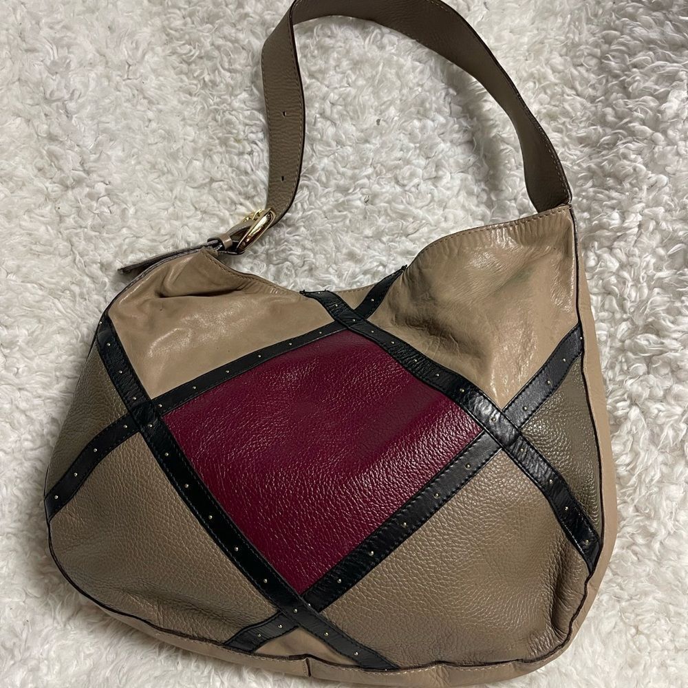 A. Bellucci leather Khaki Satchel with patch work accents, gay, burgundy &black.